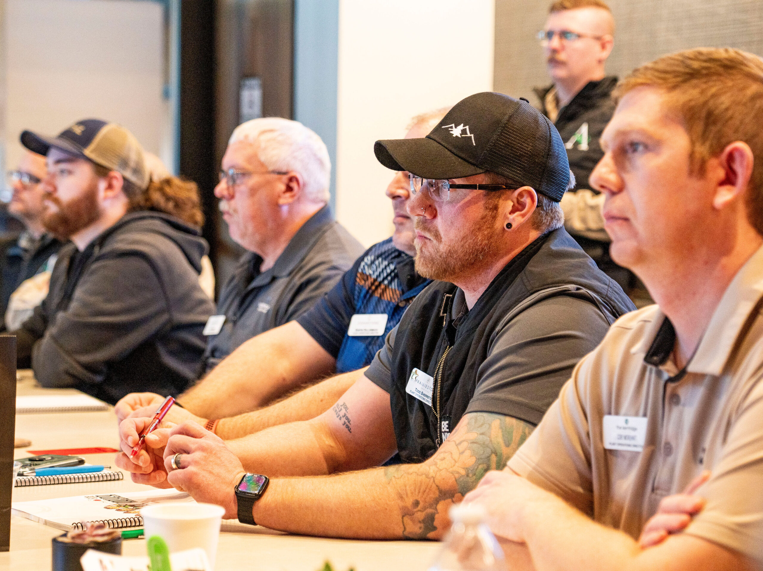 Arrow Senior Living directors listen attentively during a leadership session at the 2025 Plant Operations Growth Summit, focused on learning and professional growth.